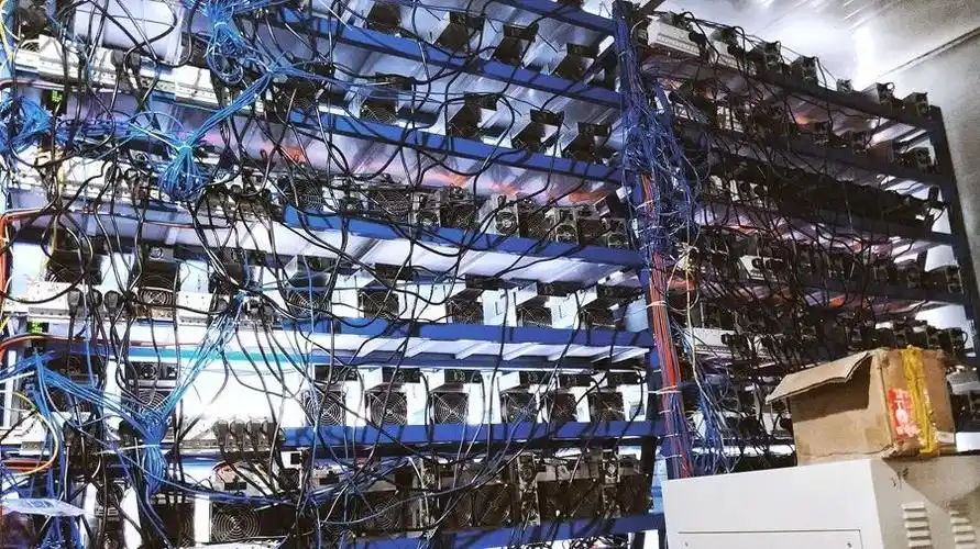 A modern cryptocurrency mining farm showcasing rows of mining rigs.